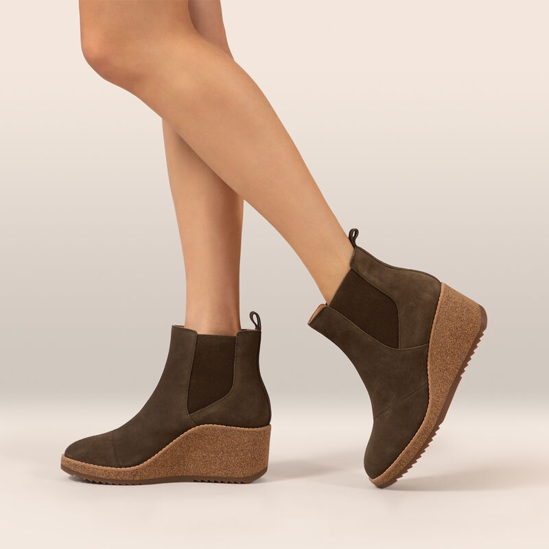 dark olive ankle wedge boot on foot